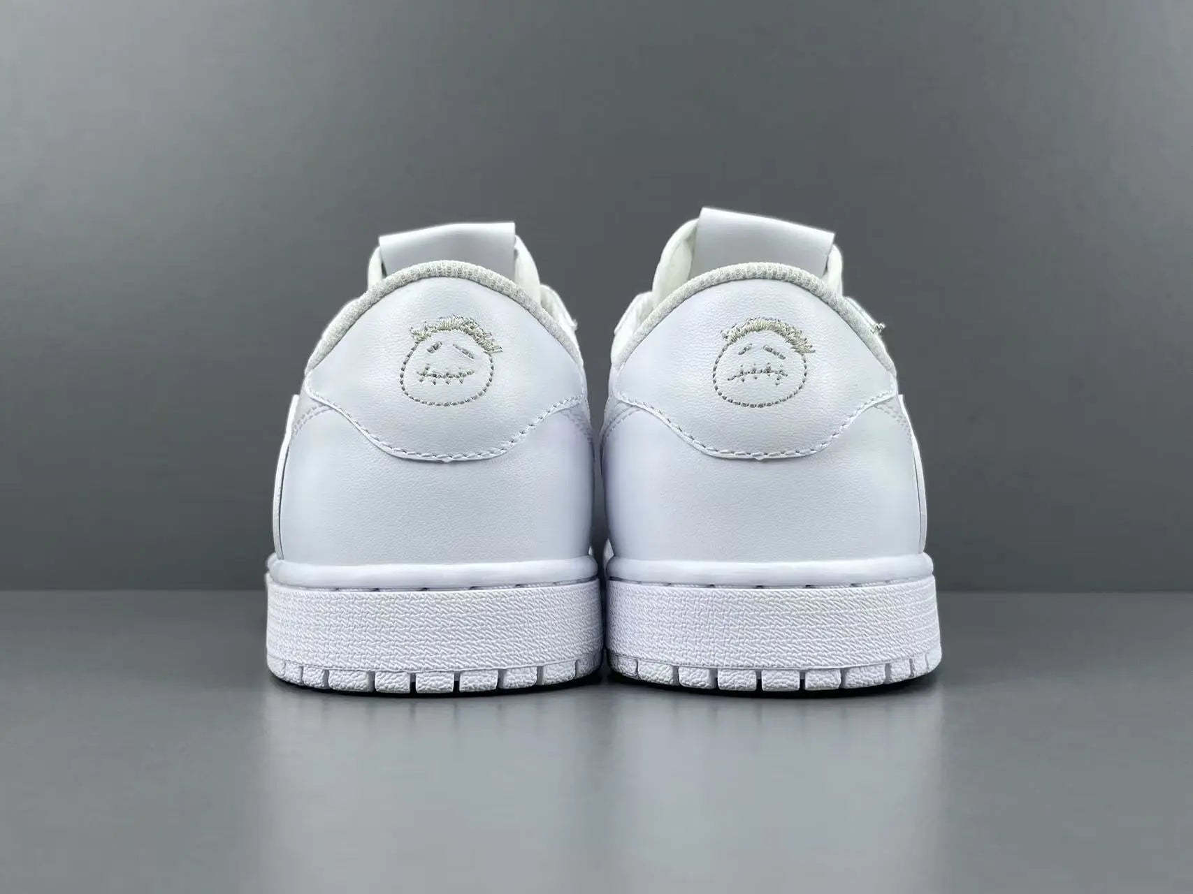 Air Jordan 1 Low Travis Scott White side view reverse Swoosh leather sneaker