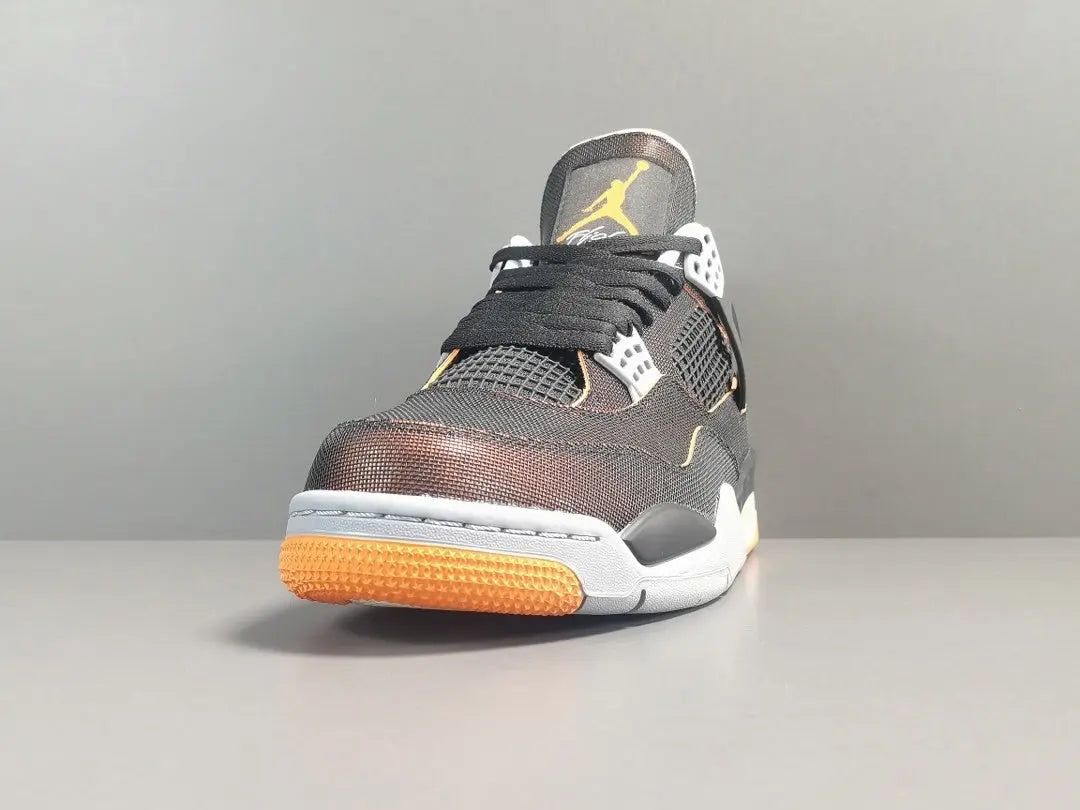 Gray sneaker with orange sole on a gray background
