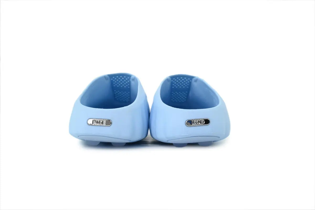 Nike Mind 001 NOCTA Slide Iceman heel view NOCTA Nike dual branding detail glacier white