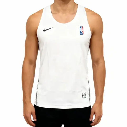 A white Nike athletic tank top worn by a model, featuring a black swoosh on the right chest and an NBA logo on the left chest, set against a plain white background.