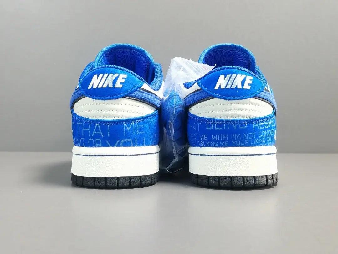 Nike Dunk Low “Jackie Robinson” sneaker with black, grey, and royal blue accents honoring the baseball legend
