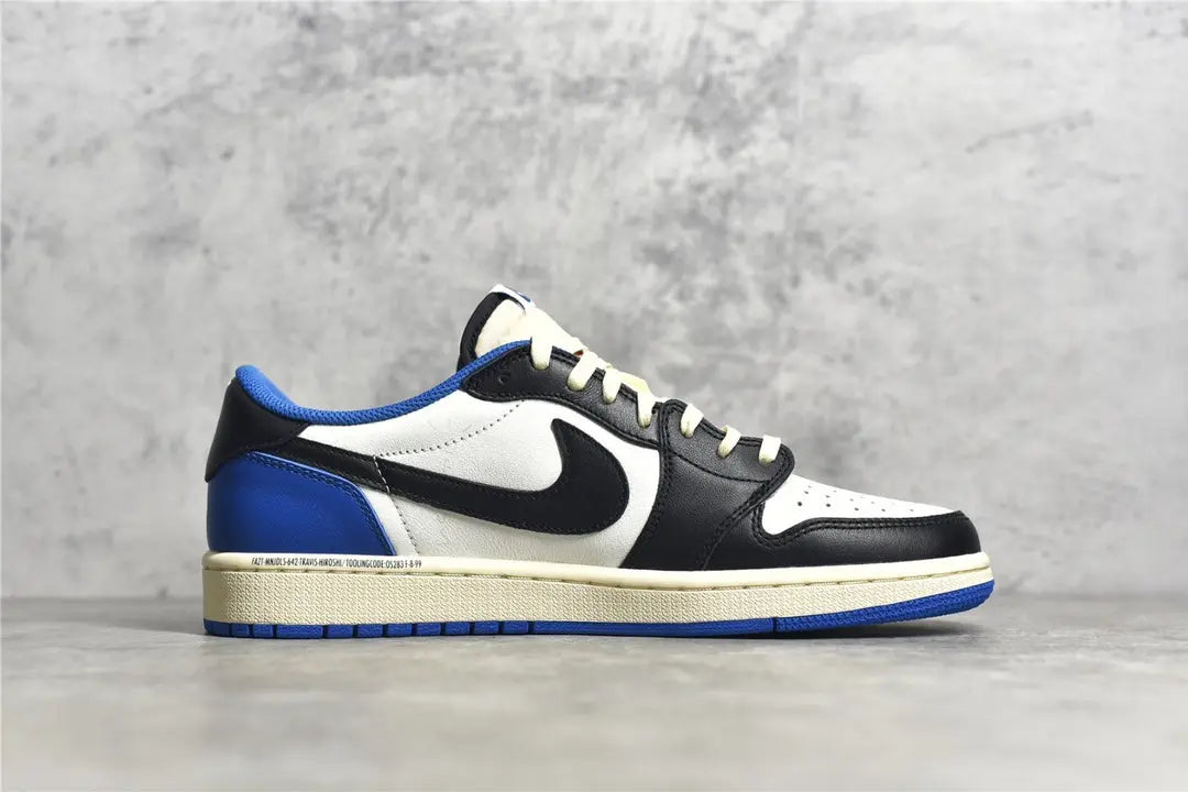 "Air Jordan 1 Low Travis Scott x Fragment – Iconic sneaker featuring a mix of white, blue, and black leather with Travis Scott’s signature reverse Swoosh and Fragment branding."