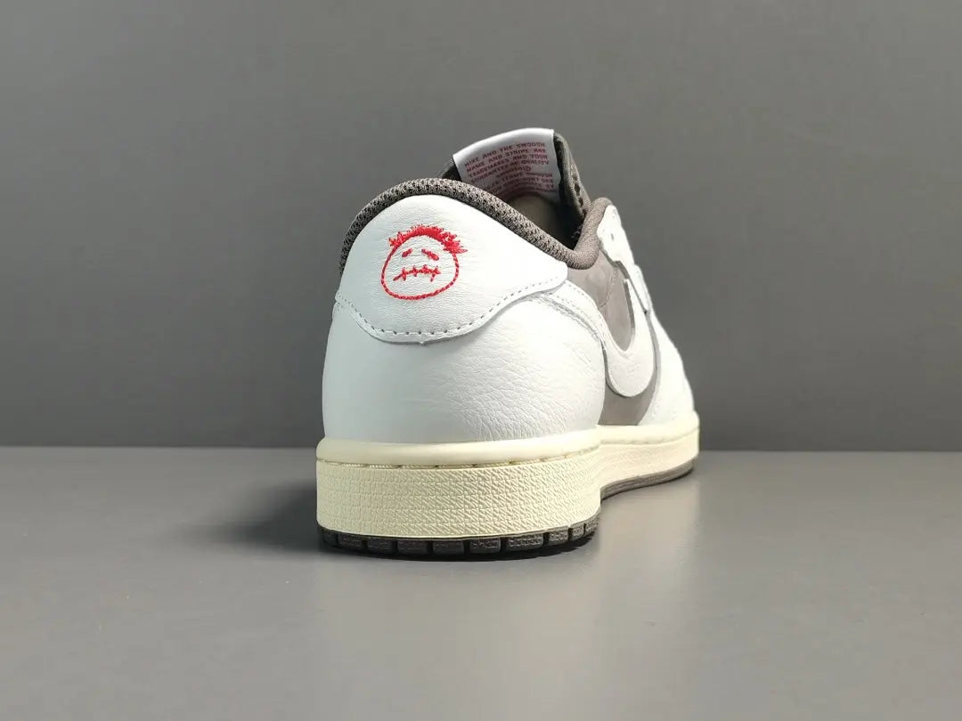 "Jordan 1 Low x Travis Scott Reverse Mocha – Mocha suede, reverse Swoosh, Cactus Jack branding, and vintage sail accents."