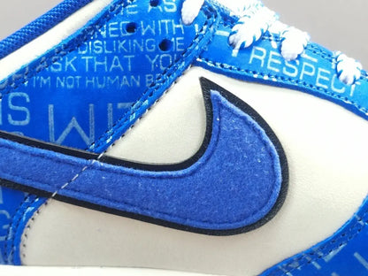 Nike Dunk Low “Jackie Robinson” sneaker with black, grey, and royal blue accents honoring the baseball legend

