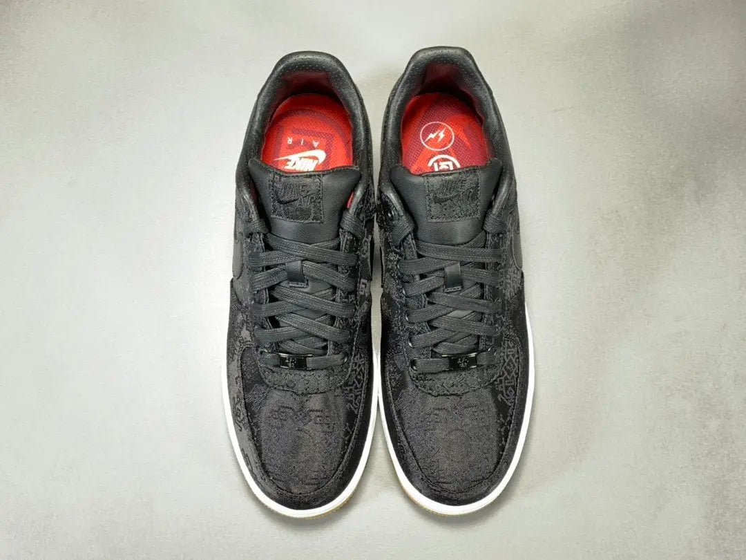 White Nike Air Force 1 x Fragment CLOT collaboration sneaker with logos
