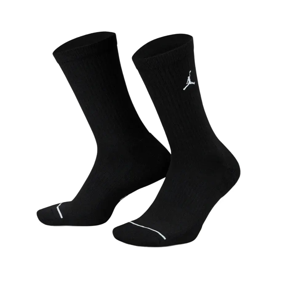 Black Jordan cotton crew socks with a soft knit texture, ribbed cuffs for a secure fit, and the iconic Jumpman logo displayed near the top.