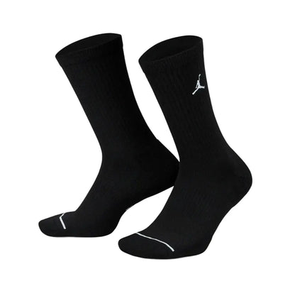 Black Jordan cotton crew socks with a soft knit texture, ribbed cuffs for a secure fit, and the iconic Jumpman logo displayed near the top.