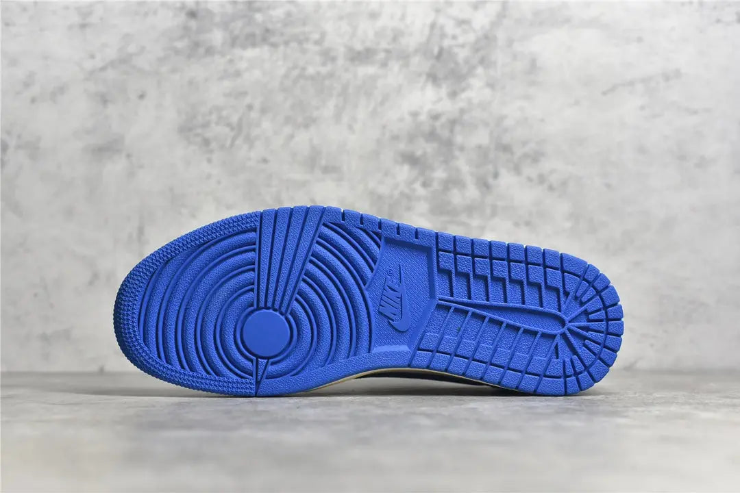 "Air Jordan 1 Low Travis Scott x Fragment – Iconic sneaker featuring a mix of white, blue, and black leather with Travis Scott’s signature reverse Swoosh and Fragment branding."