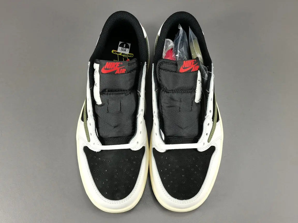 "Jordan 1 Low x Travis Scott Olive with olive suede, black leather overlays, reverse Swoosh, and Cactus Jack branding."