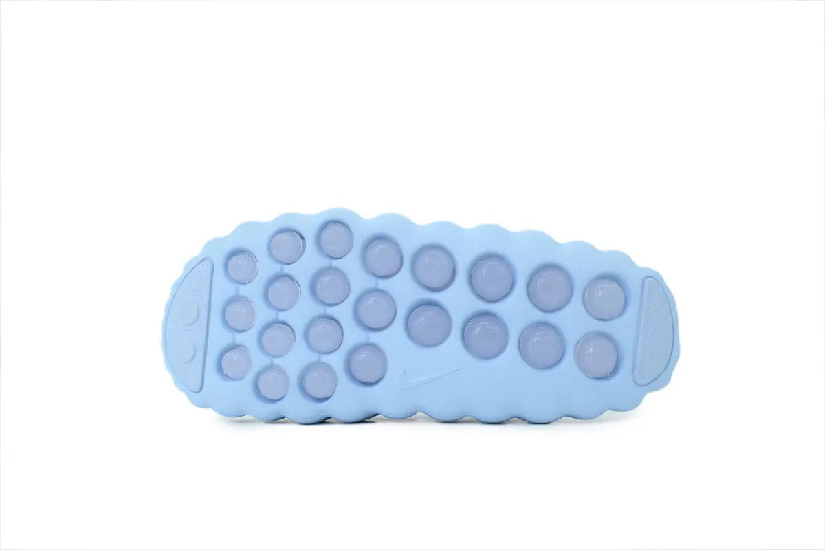 Nike Mind 001 NOCTA Slide Iceman white outsole bottom view traction pattern sole detail