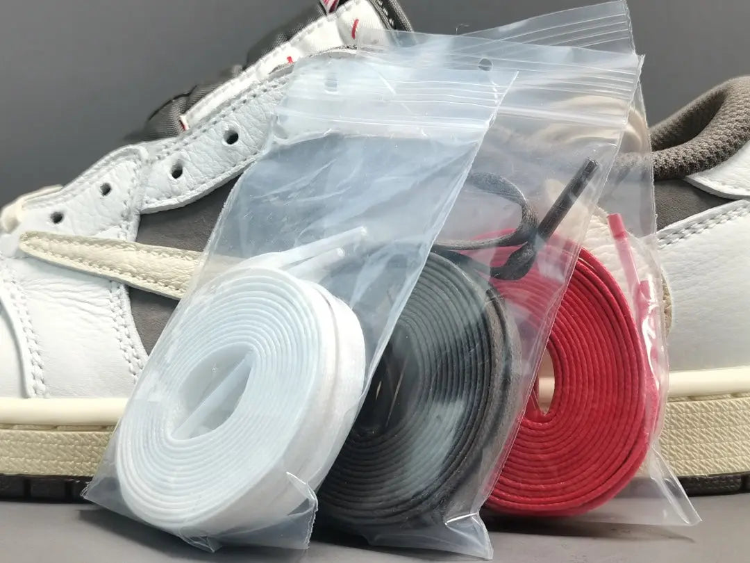 "Jordan 1 Low x Travis Scott Reverse Mocha – Mocha suede, reverse Swoosh, Cactus Jack branding, and vintage sail accents."