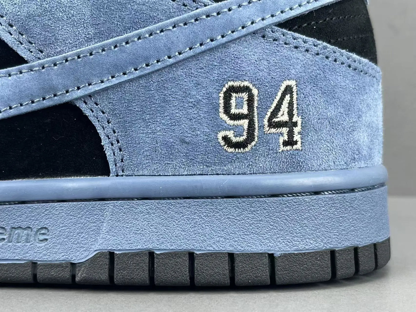 Nike SB Dunk Supreme 94 Ocean Fog low top sneaker side view grey white