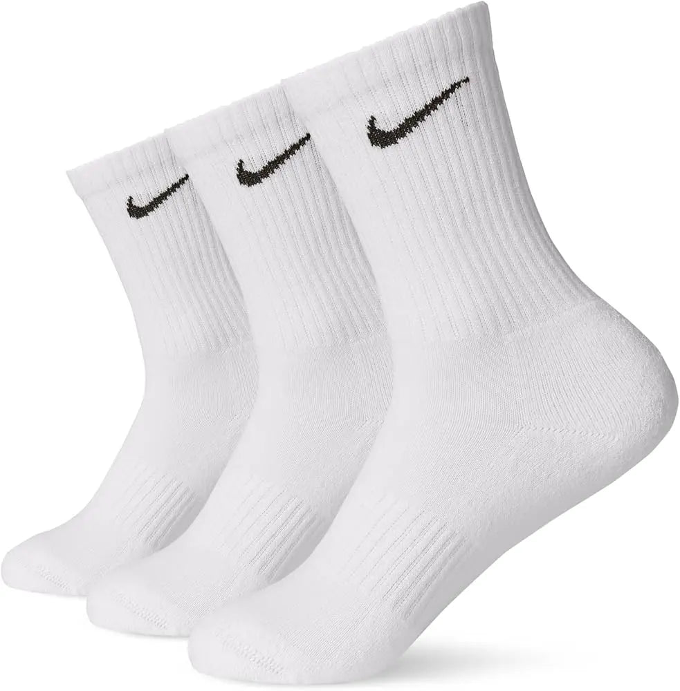 White Nike cotton crew socks featuring a soft knit texture, ribbed cuffs for a secure fit, and the signature black Nike swoosh logo near the top.