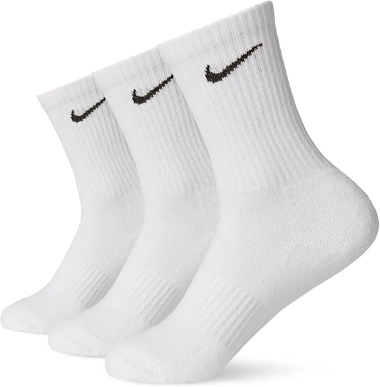 White Nike cotton crew socks featuring a soft knit texture, ribbed cuffs for a secure fit, and the signature black Nike swoosh logo near the top.