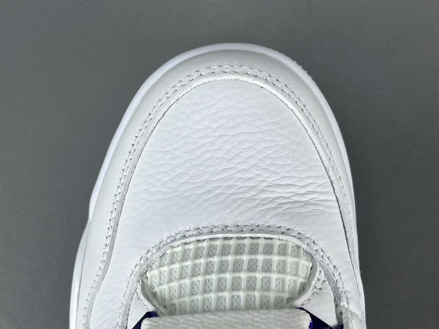 Air Jordan 4 Metallic Purple clean white sneakers with metallic purple details