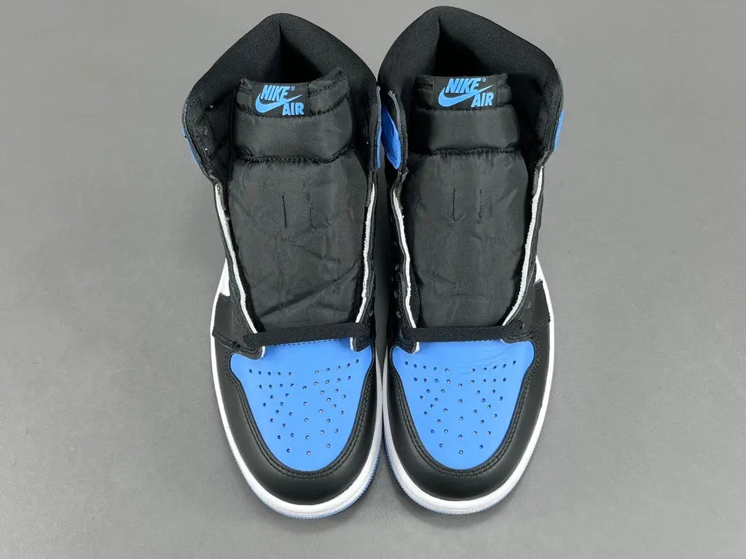 Air Jordan 1 High OG UNC Toe side view black white university blue sneaker