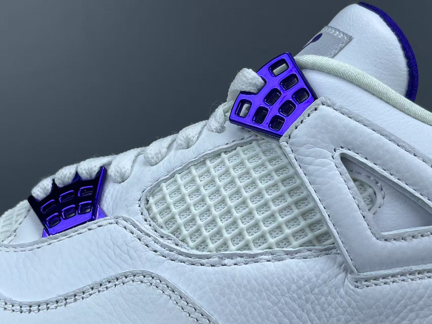 Air Jordan 4 Metallic Purple clean white sneakers with metallic purple details