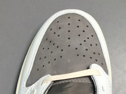 "Jordan 1 Low x Travis Scott Reverse Mocha – Mocha suede, reverse Swoosh, Cactus Jack branding, and vintage sail accents."