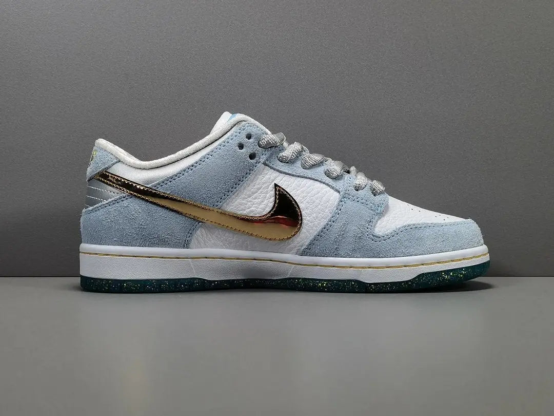 Nike SB Dunk Low Sean Cliver white gold sneaker holiday special edition red velvet lining skate shoe