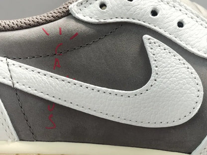 "Jordan 1 Low x Travis Scott Reverse Mocha – Mocha suede, reverse Swoosh, Cactus Jack branding, and vintage sail accents."