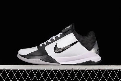 Side view of Nike Kobe 5 Protro in White/Black colorway showing the low-profile silhouette, black Nike Swoosh, and synthetic upper with fused overlays