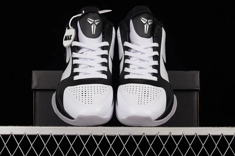 Top-down view of Nike Kobe 5 Protro White/Black featuring the embroidered Kobe Sheath logo on the tongue and lace-up closure on a predominantly white upper
