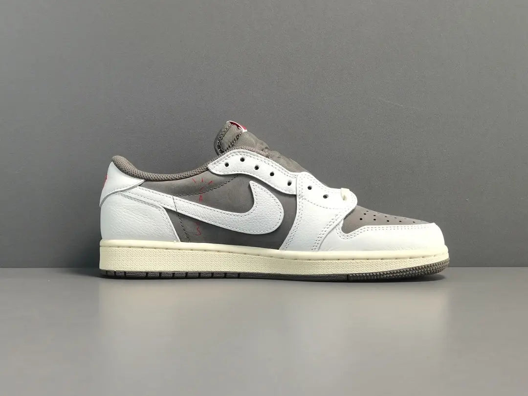 "Jordan 1 Low x Travis Scott Reverse Mocha – Mocha suede, reverse Swoosh, Cactus Jack branding, and vintage sail accents."