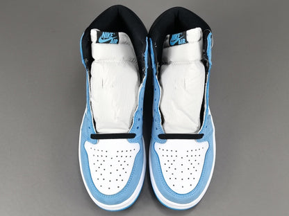 Jordan 1 Retro High OG University Blue sneakers with suede overlays and classic style.