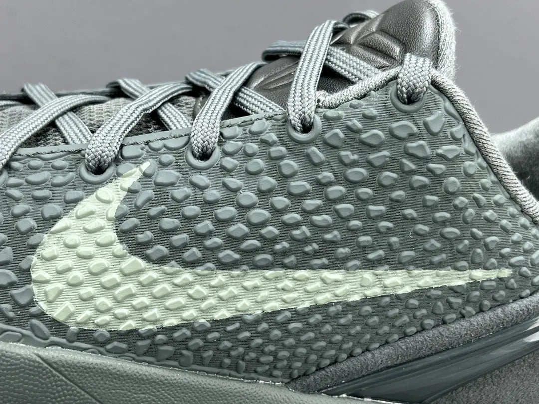 “Black and purple Nike Kobe 6 Protro sneakers with ‘Fade to Black’ design.”
