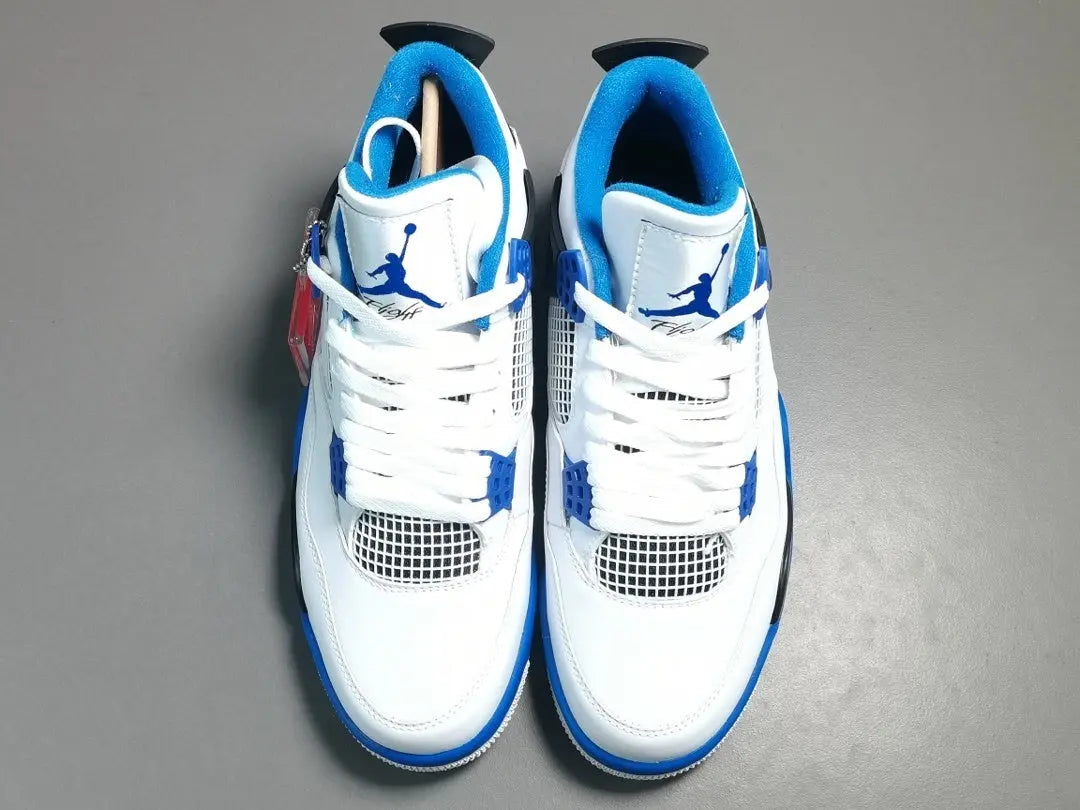Air Jordan 4 x Motorsports sneakers black red white racing-inspired design
