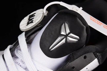Heel detail of Nike Kobe 5 Protro White/Black basketball shoes highlighting the black heel counter, external support, and clean white-to-black color blocking
