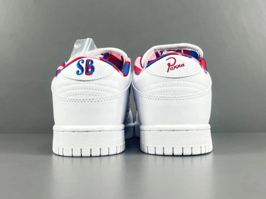 Nike SB Dunk Low Parra white sneaker with pink blue green abstract overlays limited edition skate shoe