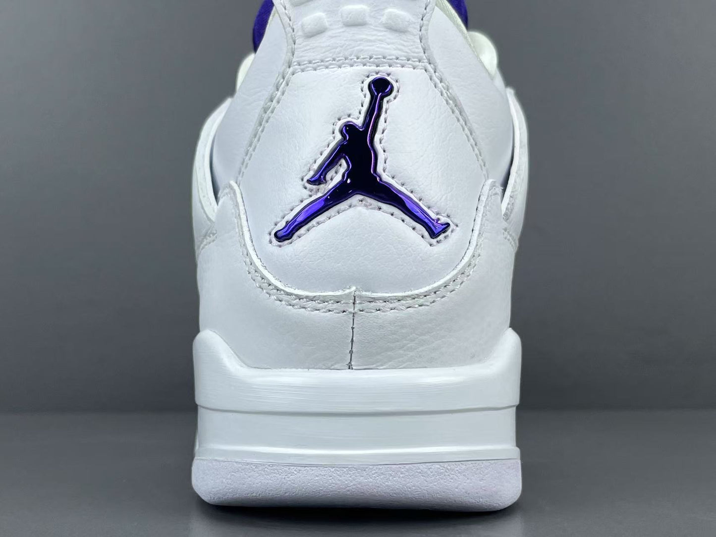 Air Jordan 4 Metallic Purple clean white sneakers with metallic purple details