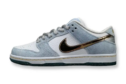 Nike SB Dunk Low Sean Cliver white gold sneaker holiday special edition red velvet lining skate shoe
