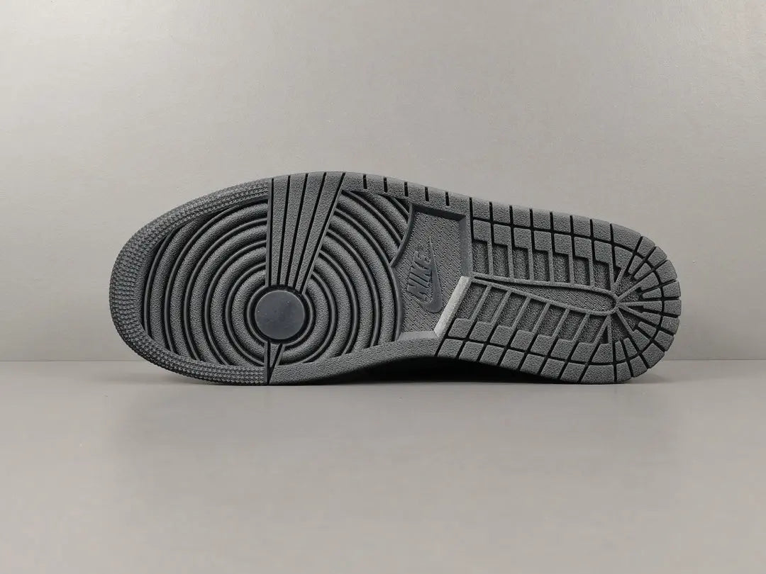 "Jordan 1 Low Travis Scott Phantom with black nubuck, white stitching, and signature reverse Swoosh."