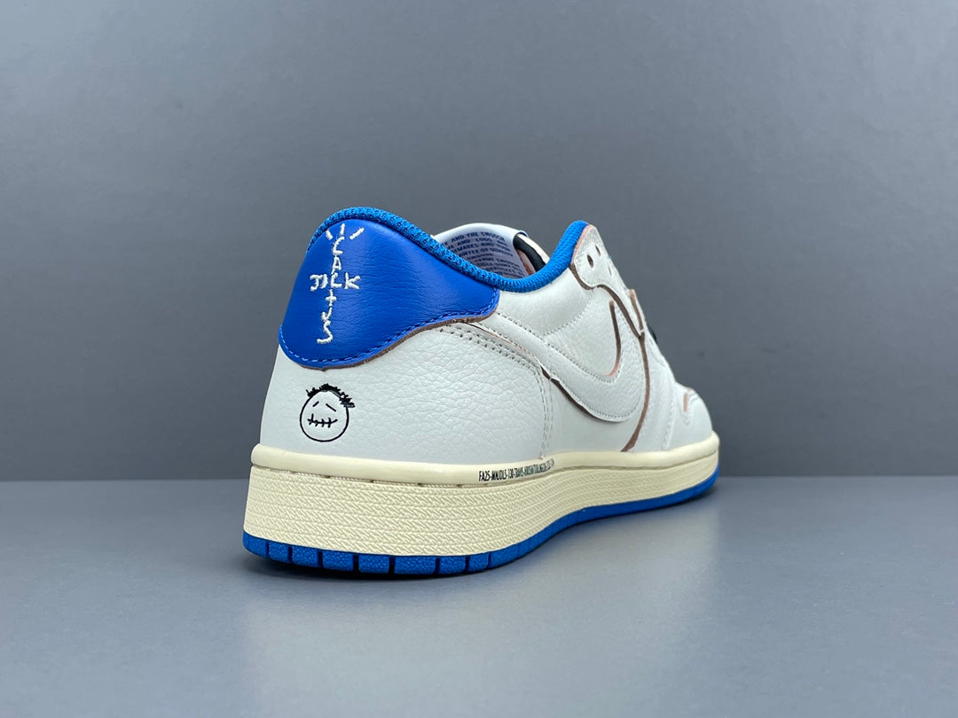 Air Jordan 1 Low OG x Travis Scott x Fragment with a white, black, and blue design, reverse Swoosh, and co-branded heel logos.