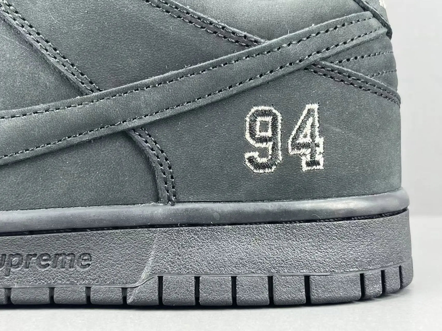 Nike SB Dunk Supreme 94 Black low top sneaker side view all black