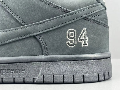 Nike SB Dunk Supreme 94 Black low top sneaker side view all black