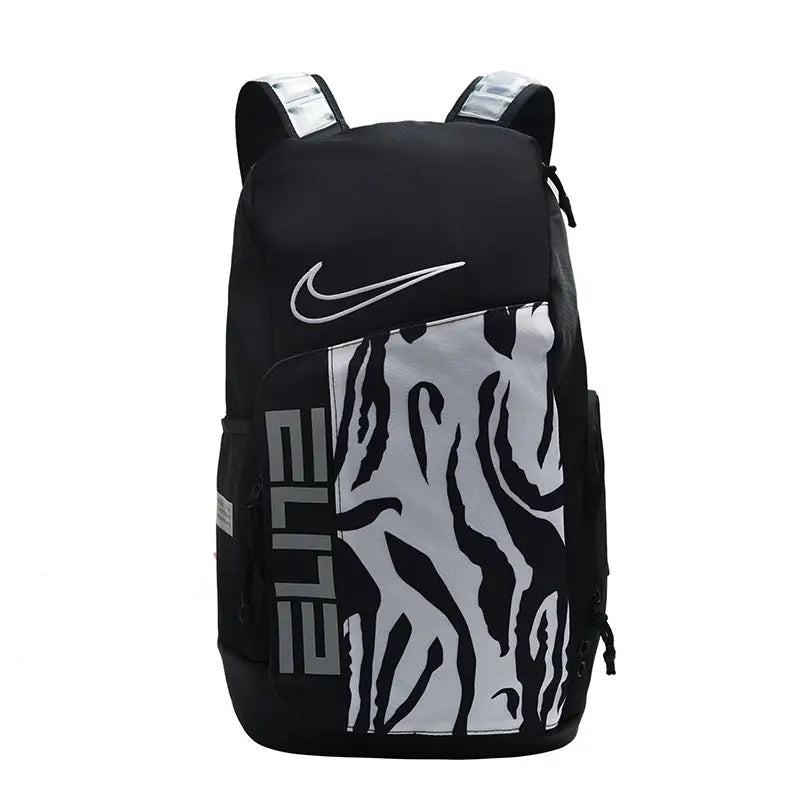 A black Nike backpack with a large white and gray zebra-stripe pattern on the front pocket, featuring a white Nike swoosh and vertical 'ELITE' text.