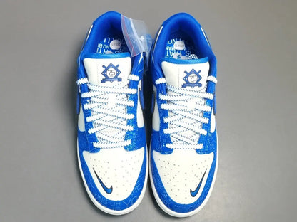Nike Dunk Low “Jackie Robinson” sneaker with black, grey, and royal blue accents honoring the baseball legend
