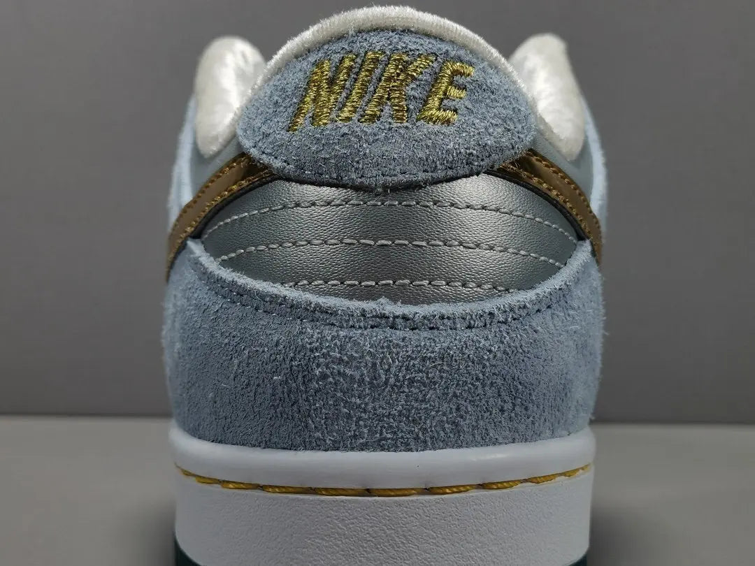 Nike SB Dunk Low Sean Cliver white gold sneaker holiday special edition red velvet lining skate shoe