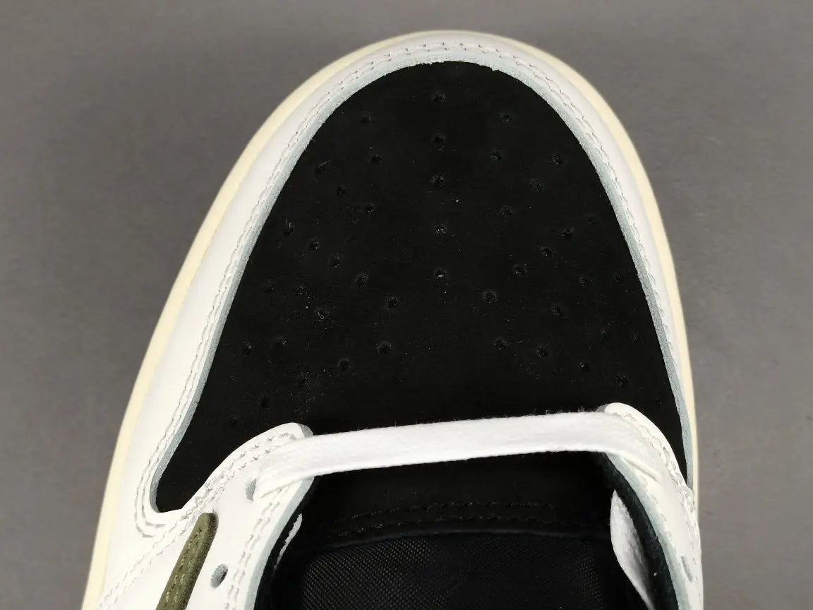 "Jordan 1 Low x Travis Scott Olive with olive suede, black leather overlays, reverse Swoosh, and Cactus Jack branding."