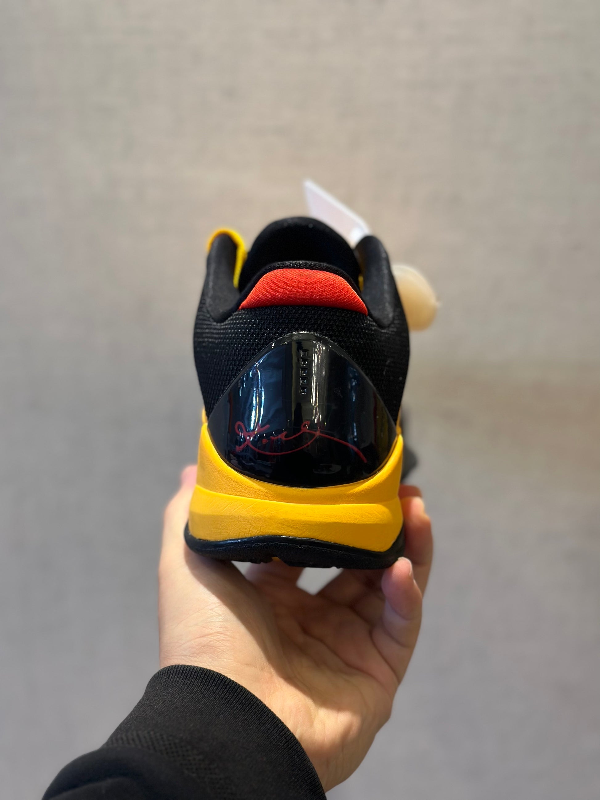 Nike Kobe 5 Protro Bruce Lee basketball shoes in yellow and black colorway
