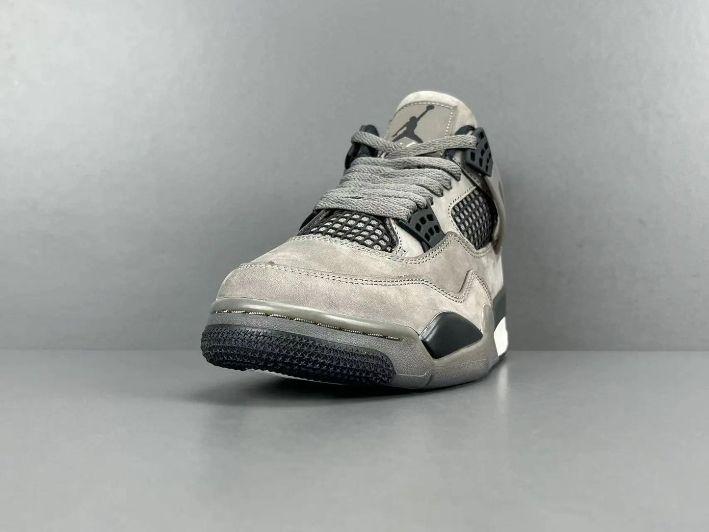 Air Jordan 4 x Cave Stone sneakers featuring premium materials neutral tones
