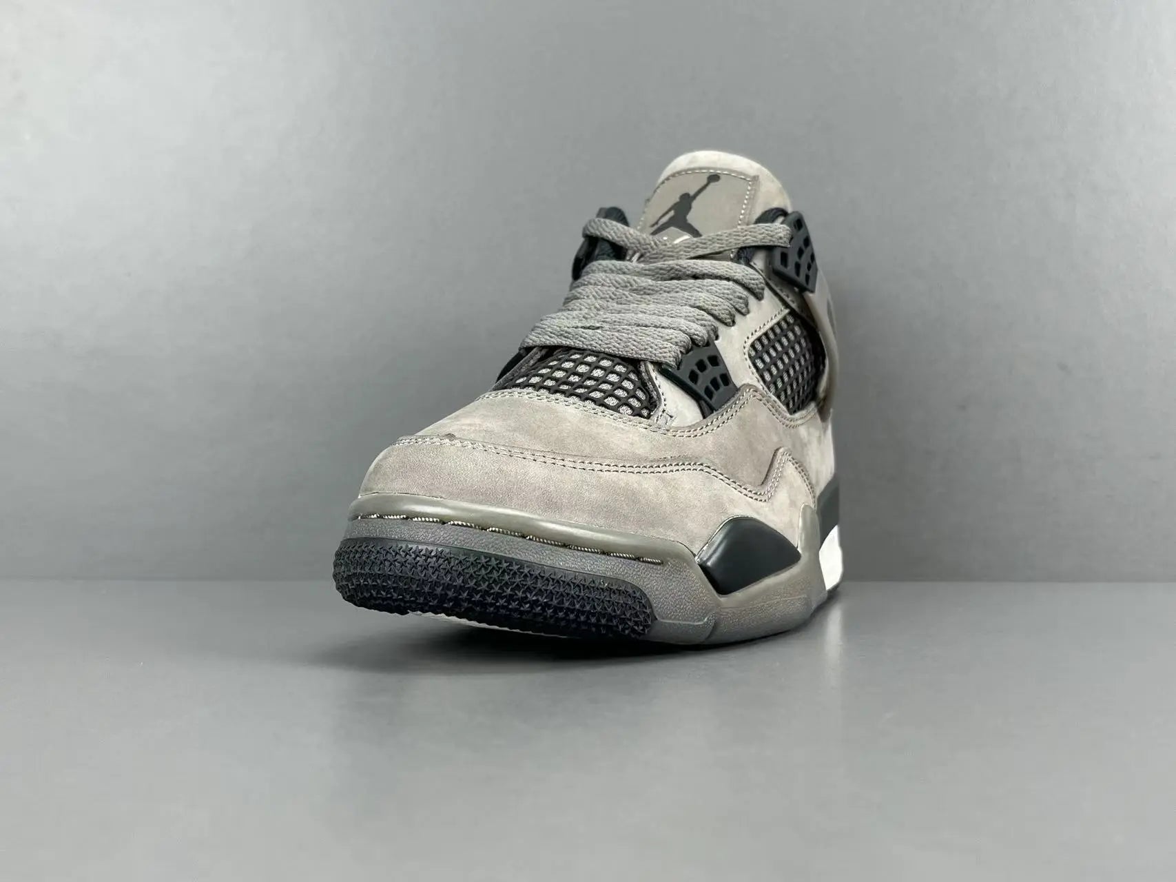 Air Jordan 4 x Cave Stone sneakers featuring premium materials neutral tones
