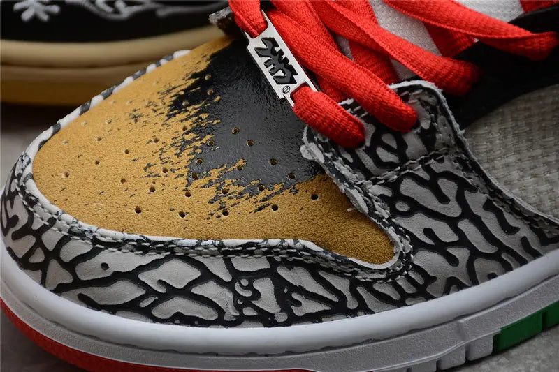 Nike SB Dunk Low What The Paul colorful patchwork upper with Nike Swoosh lateral view on white background