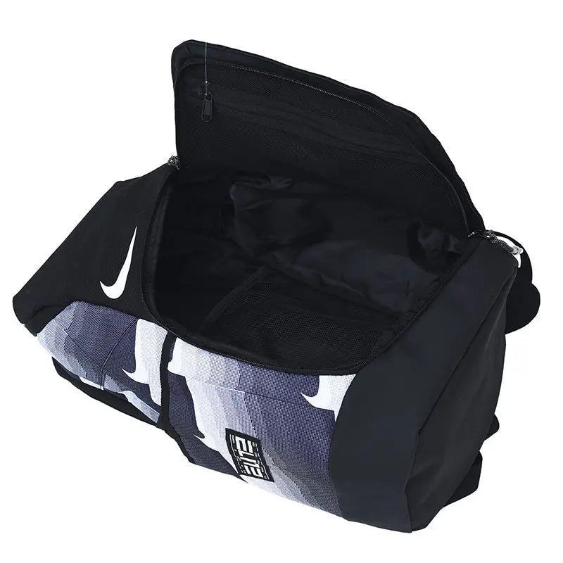 A black Nike duffel bag with a gray and white camouflage pattern on the lower front panel, shown with its top zippered compartment open on a white background.