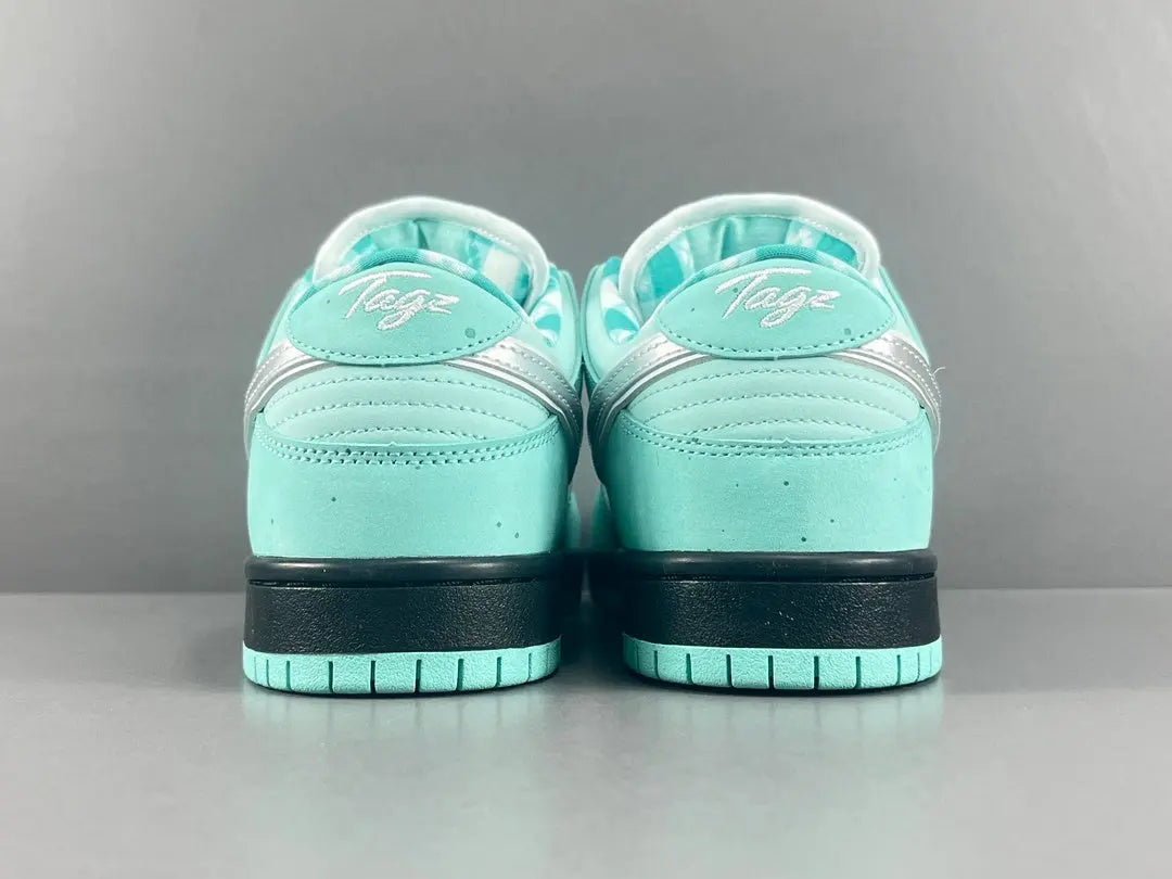 Nike SB Dunk Tiffany Lobster low top sneaker side view aqua white