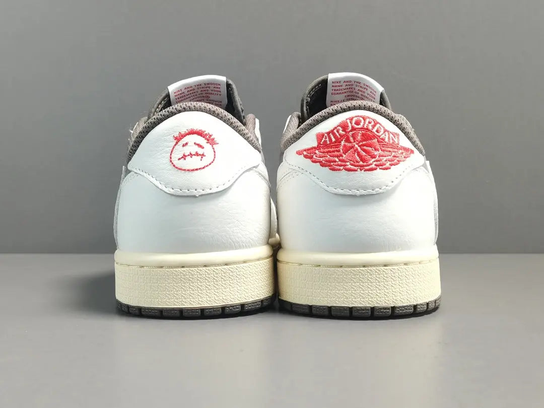 "Jordan 1 Low x Travis Scott Reverse Mocha – Mocha suede, reverse Swoosh, Cactus Jack branding, and vintage sail accents."