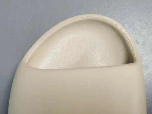"adidas Yeezy Slide x Bone – sleek beige slide with soft EVA foam, minimalist design, and ridged outsole for comfort and traction."